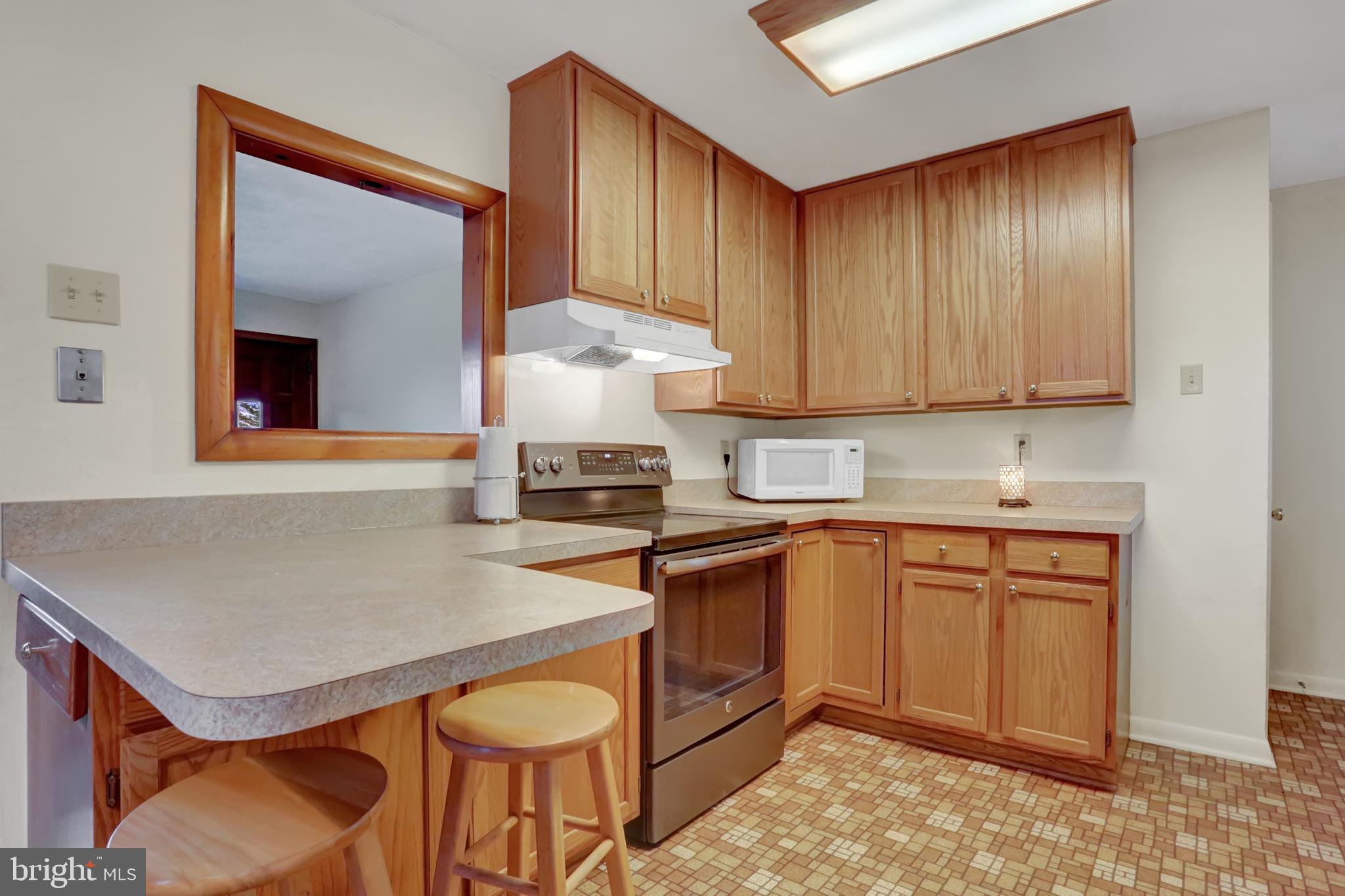 238 Clark Road Hershey, PA 17033 - Photo 2 of 24 Remodeled Kitchen:Large window opening into LR