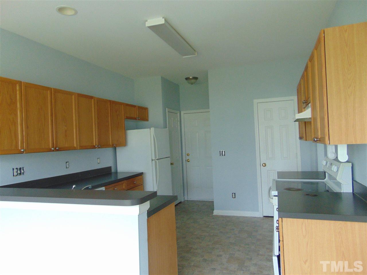 3828 Pin Oak Road Raleigh, NC 27604 - Photo 4 of 10 a kitchen with a sink and a cabinets