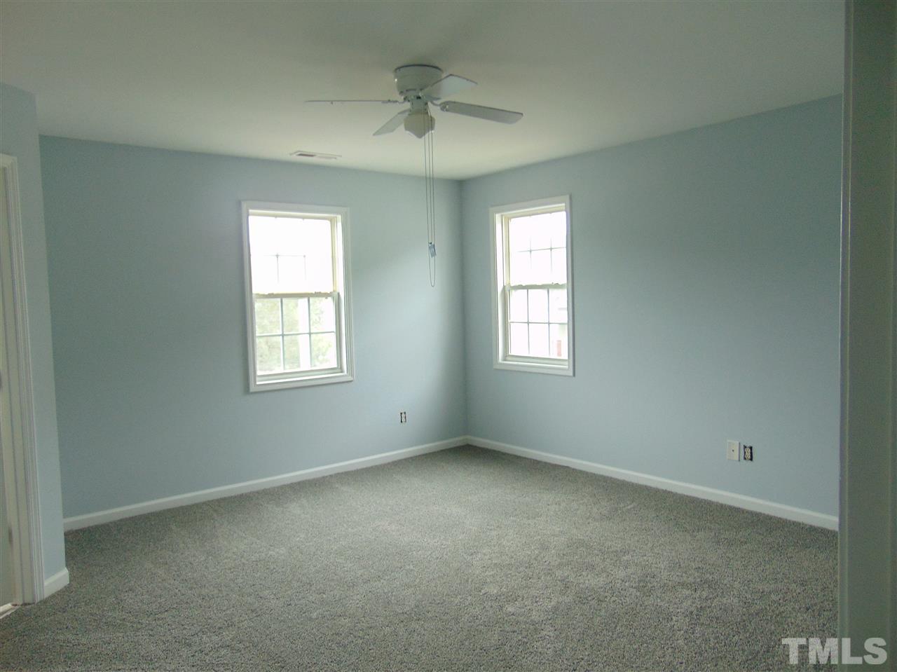 3828 Pin Oak Road Raleigh, NC 27604 - Photo 8 of 10 an empty room with a window