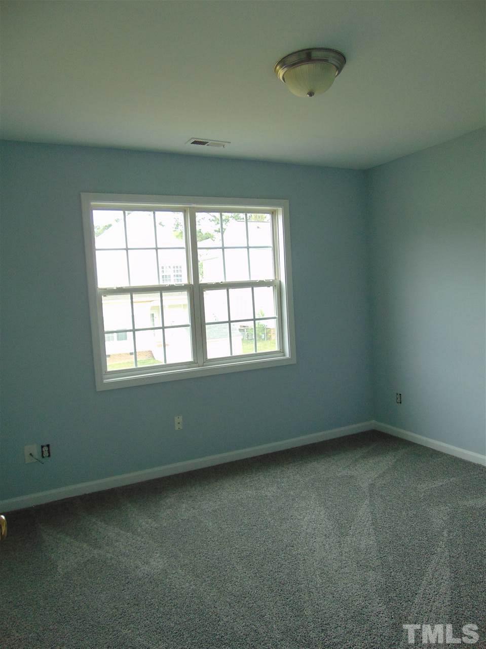 3828 Pin Oak Road Raleigh, NC 27604 - Photo 9 of 10 an empty room with a window