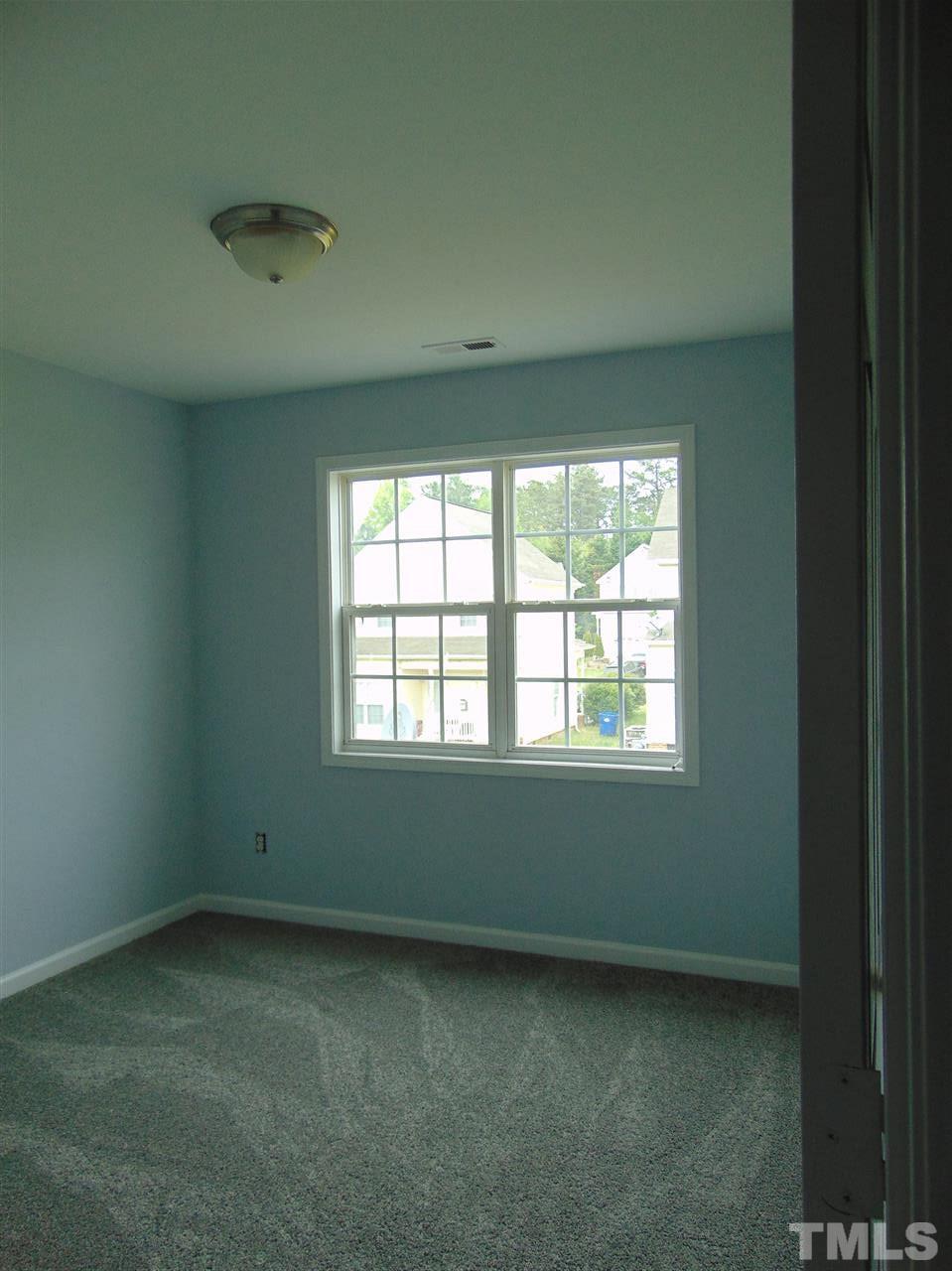 3828 Pin Oak Road Raleigh, NC 27604 - Photo 10 of 10 an empty room with a window