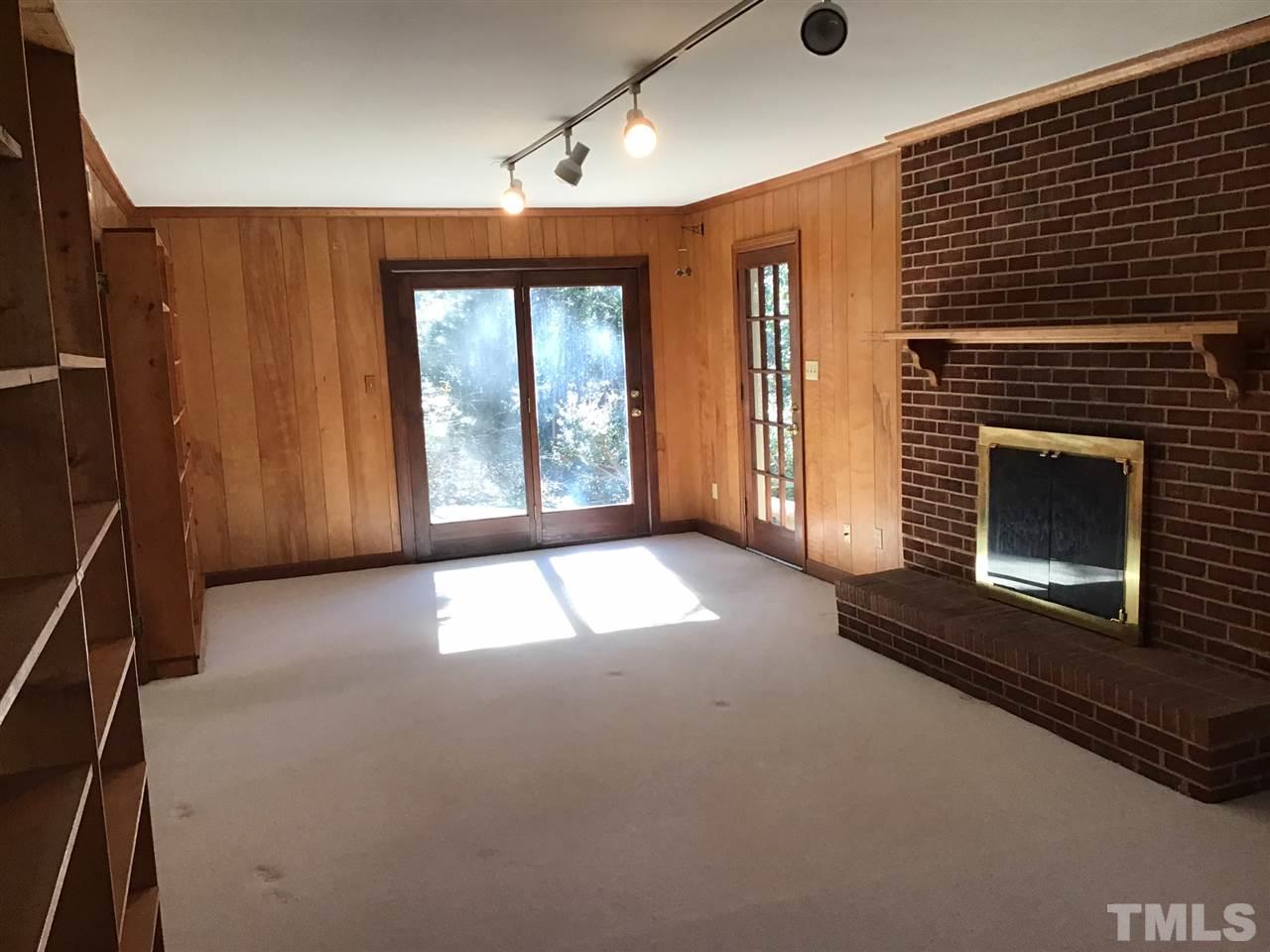 3701 Pembrook Place Raleigh, NC 27612 - Photo 11 of 30 a view of empty room with a fireplace