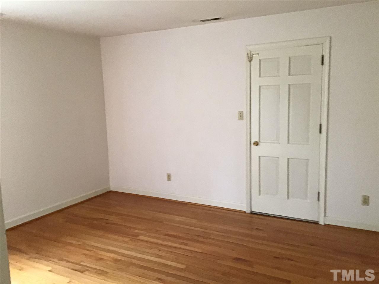 3701 Pembrook Place Raleigh, NC 27612 - Photo 14 of 30 an empty room with wooden floor and closet