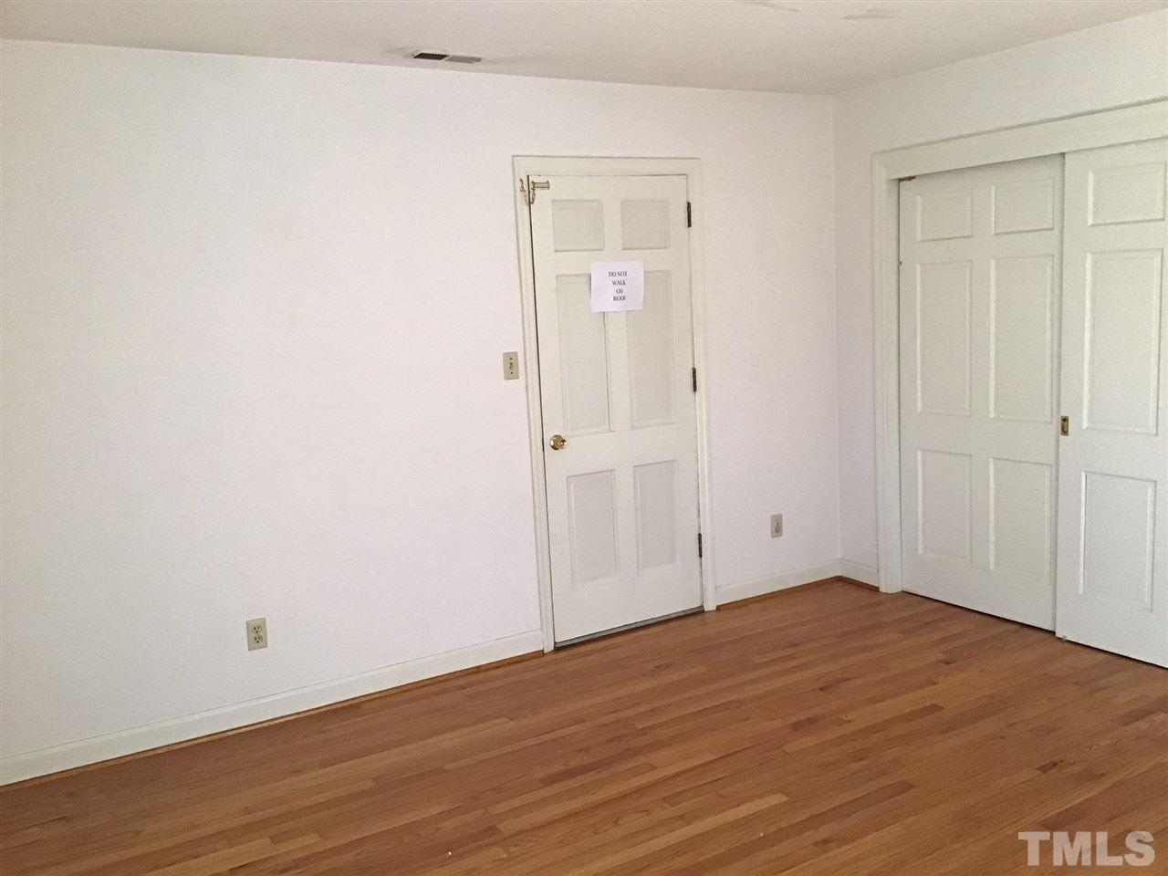 3701 Pembrook Place Raleigh, NC 27612 - Photo 15 of 30 an empty room with wooden floor