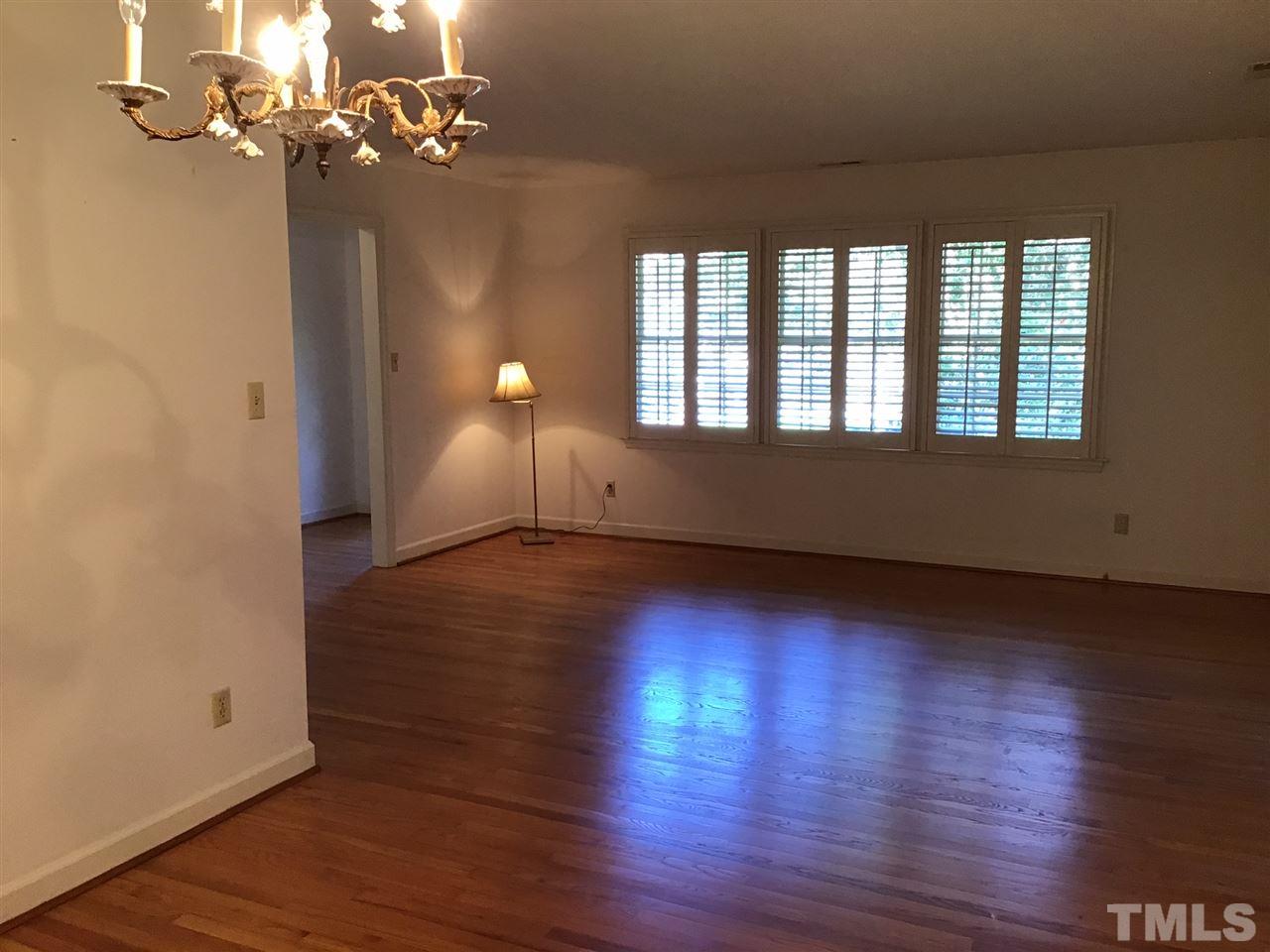 3701 Pembrook Place Raleigh, NC 27612 - Photo 3 of 30 wooden floor in an empty room with a window