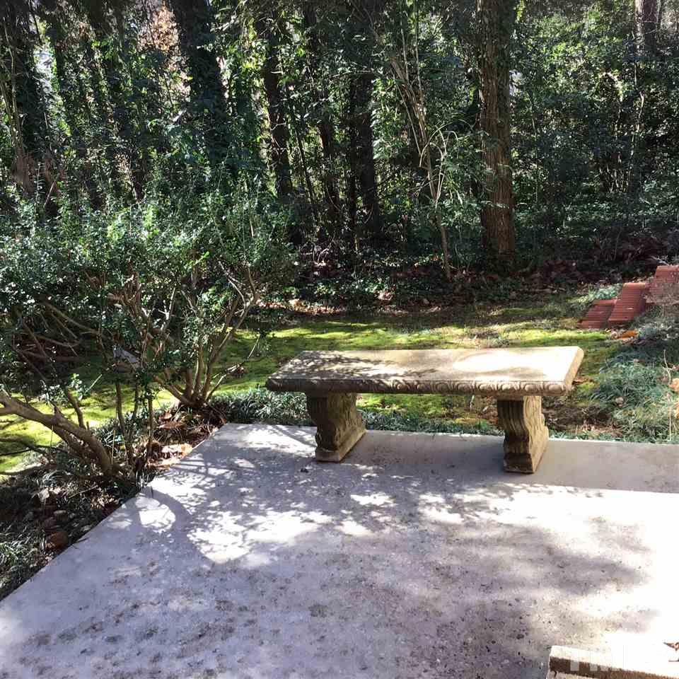 3701 Pembrook Place Raleigh, NC 27612 - Photo 25 of 30 a view of a bench in a yard