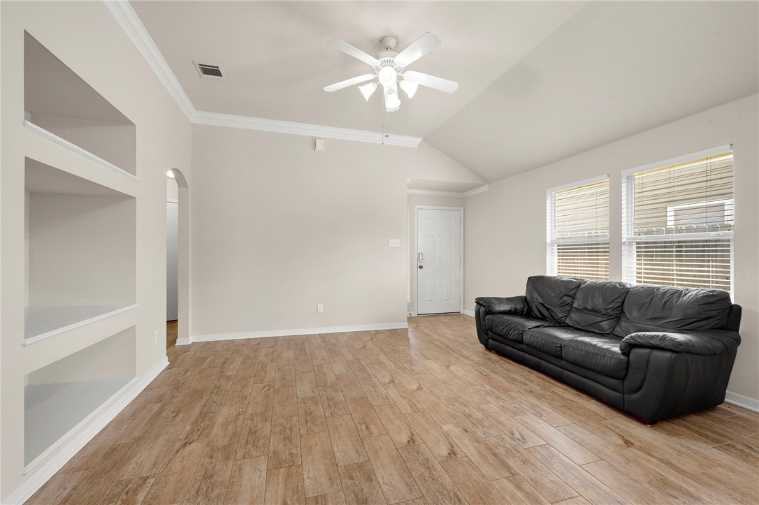 919 Windmeadows Drive College Station, TX 77845 - Photo 4 of 12 a living room with furniture and a large window
