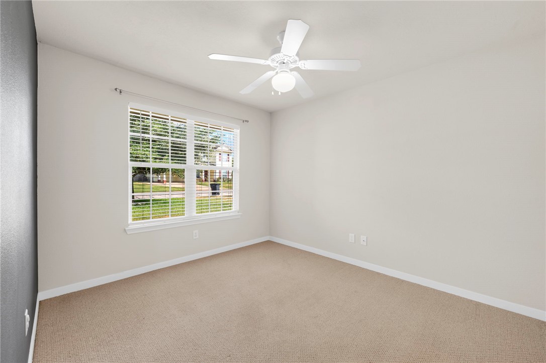 919 Windmeadows Drive College Station, TX 77845 - Photo 9 of 12 an empty room with a window