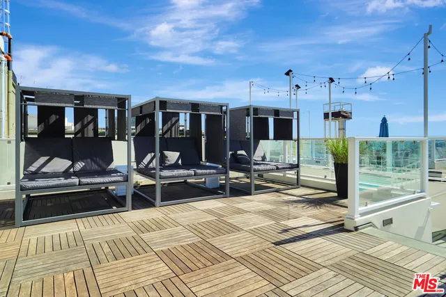 a view of a dinning table and chairs in patio of the house