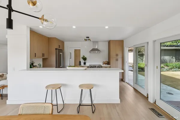 a kitchen with a table and chairs in it