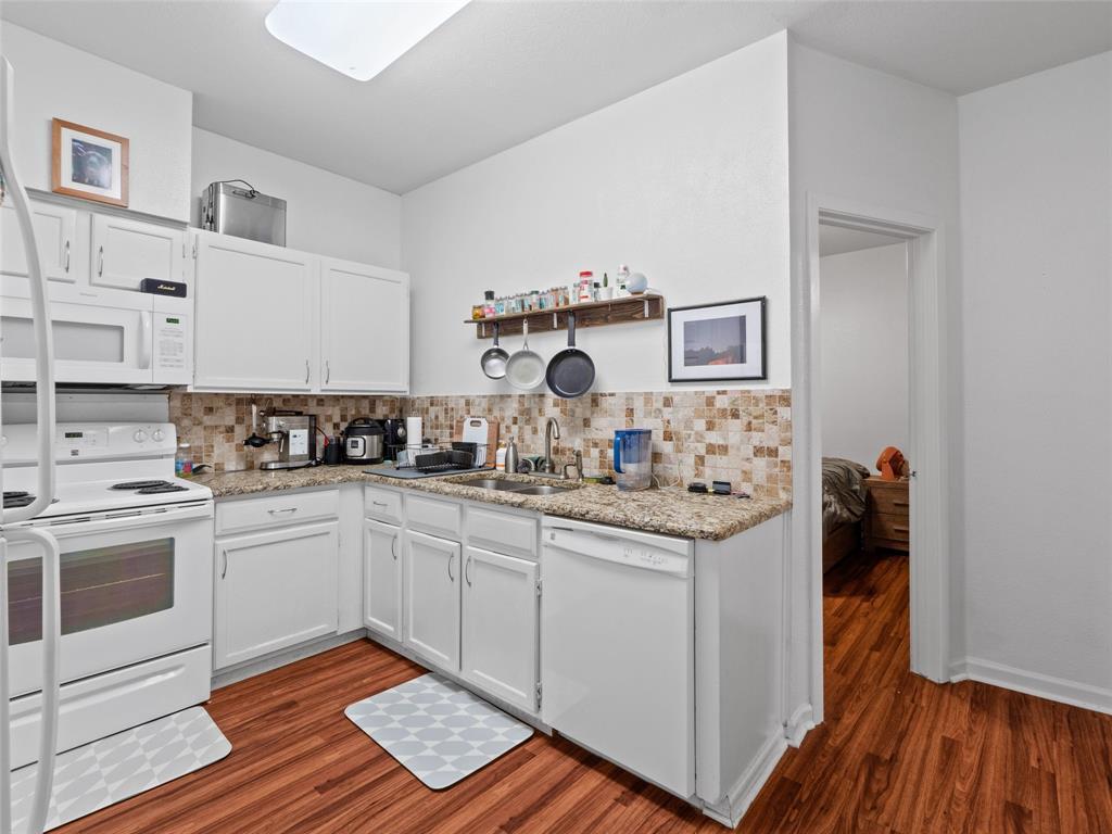 2801 Rio Grande Street, Unit 205 Austin, TX 78705 - Photo 12 of 25 a kitchen with a sink and cabinets