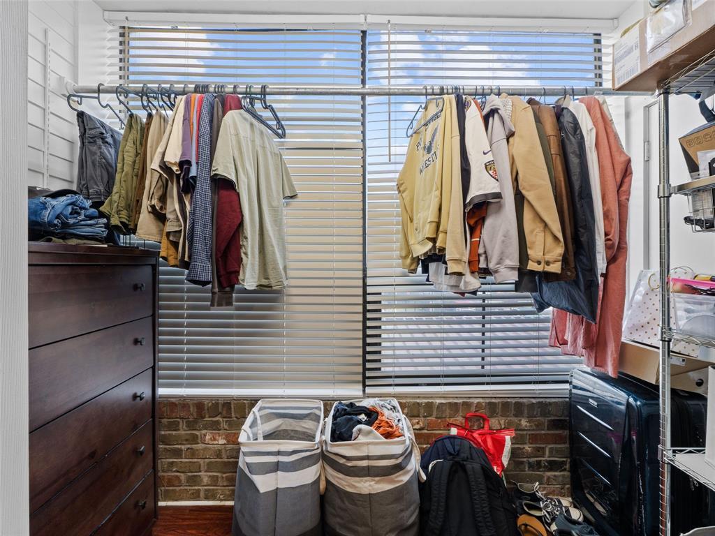 2801 Rio Grande Street, Unit 205 Austin, TX 78705 - Photo 14 of 25 a view of walk in closet with clothes and shoes