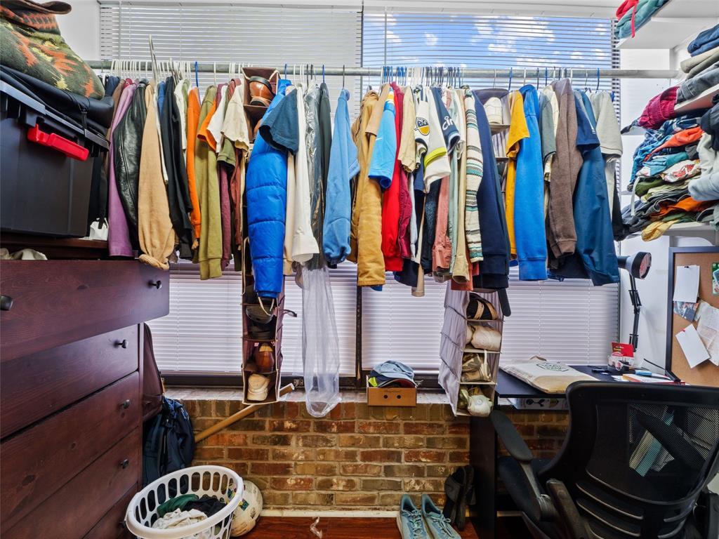 2801 Rio Grande Street, Unit 205 Austin, TX 78705 - Photo 18 of 25 a view of walk in closet with clothes