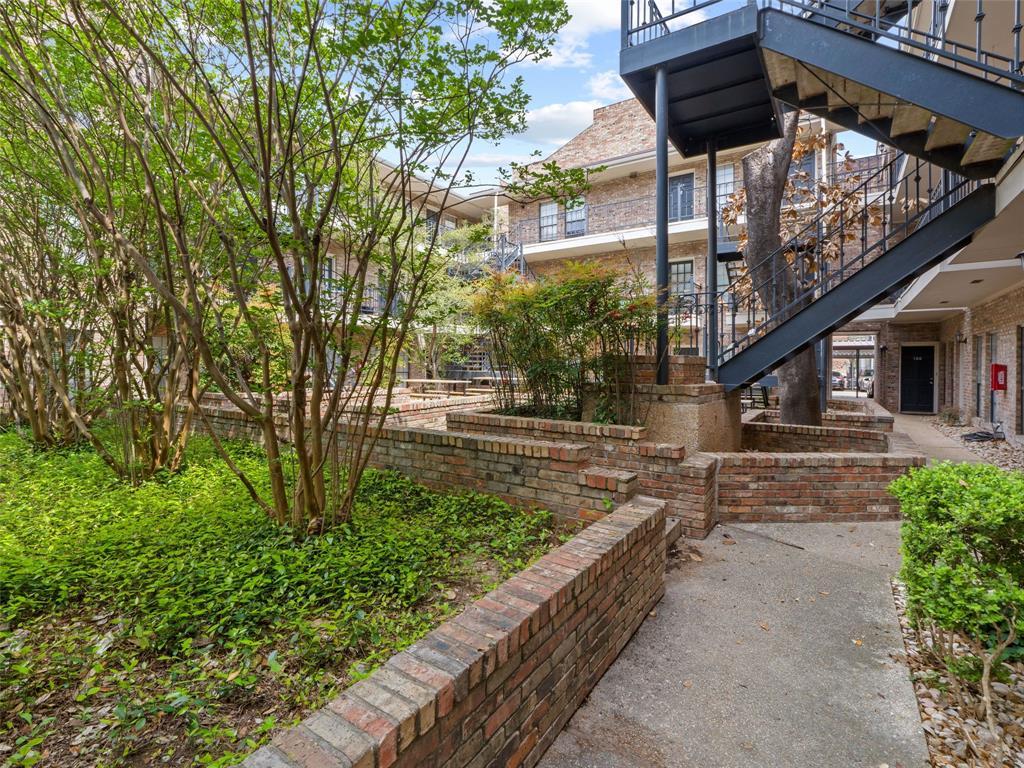 2801 Rio Grande Street, Unit 205 Austin, TX 78705 - Photo 4 of 25 a view of a pathway of a house with a tree