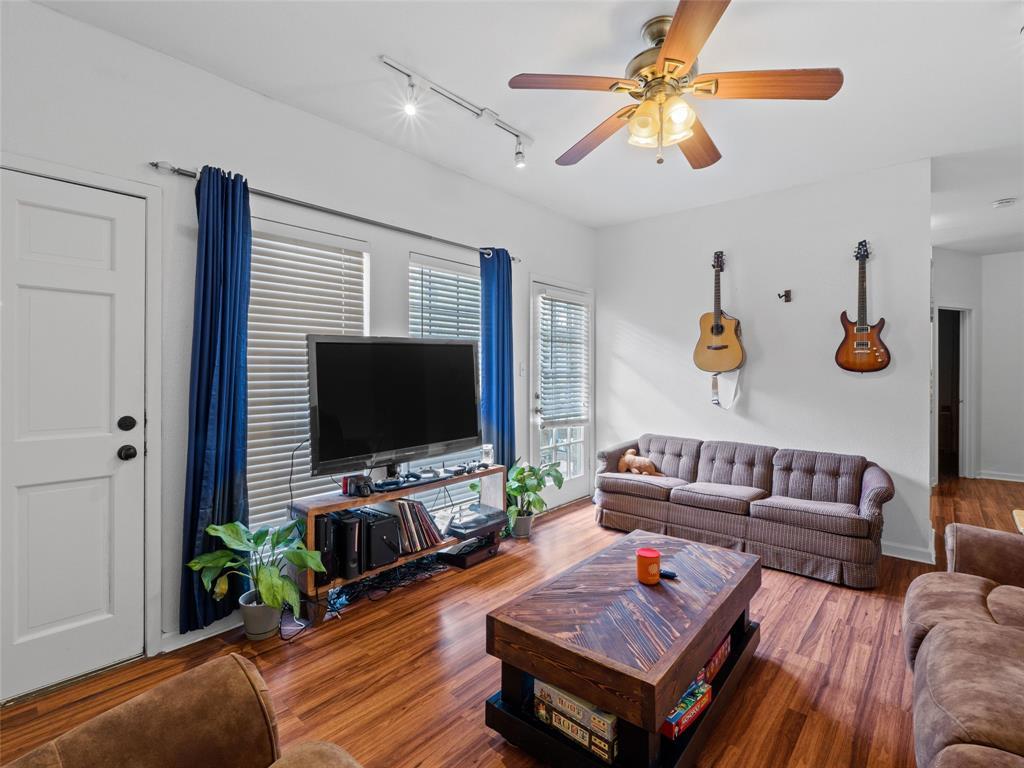 2801 Rio Grande Street, Unit 205 Austin, TX 78705 - Photo 8 of 25 a living room with furniture and a flat screen tv