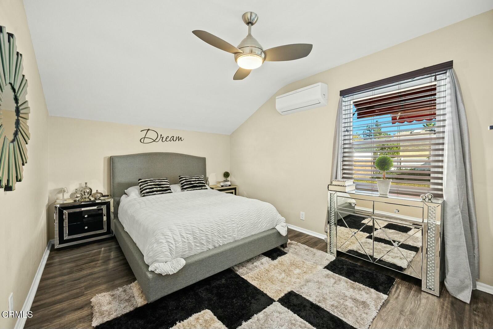 6708 Ranchito Avenue Van Nuys, CA 91405 - Photo 18 of 37 a bedroom with a bed and a window