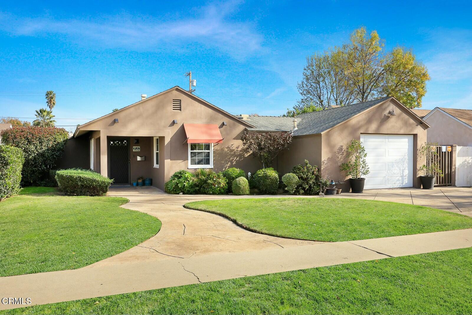 6708 Ranchito Avenue Van Nuys, CA 91405 - Photo 2 of 37 a front view of a house with a yard