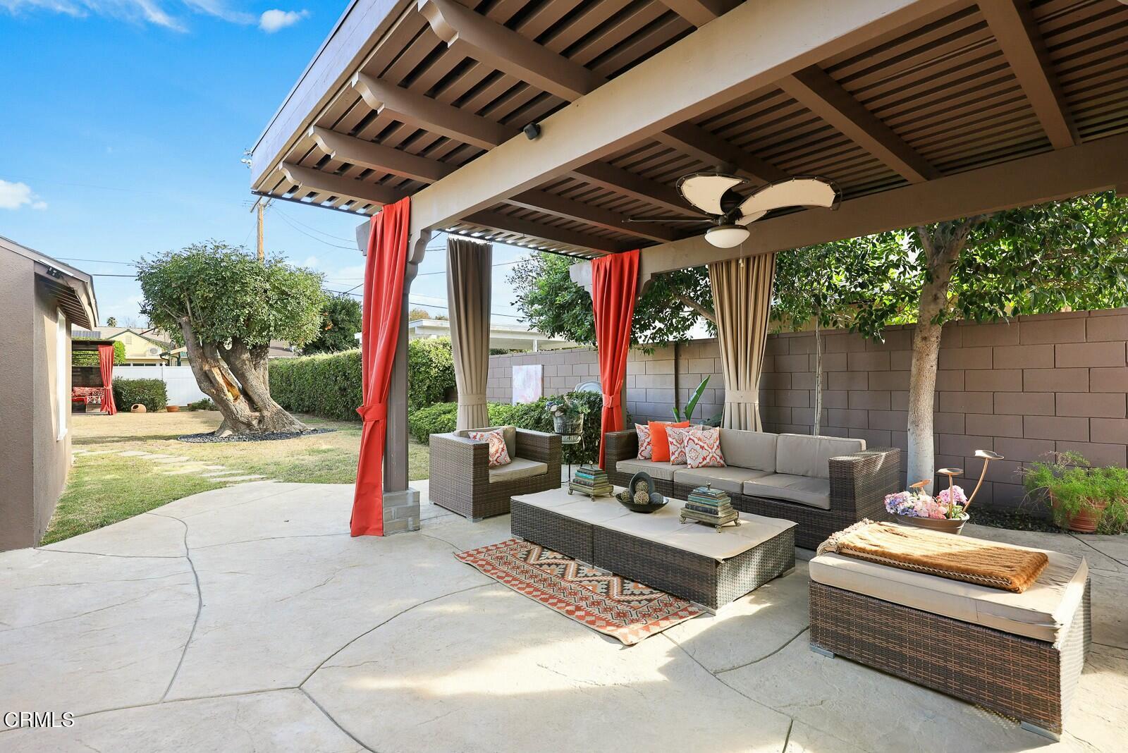 6708 Ranchito Avenue Van Nuys, CA 91405 - Photo 23 of 37 a outdoor space with patio the couches and a dining table with garden view