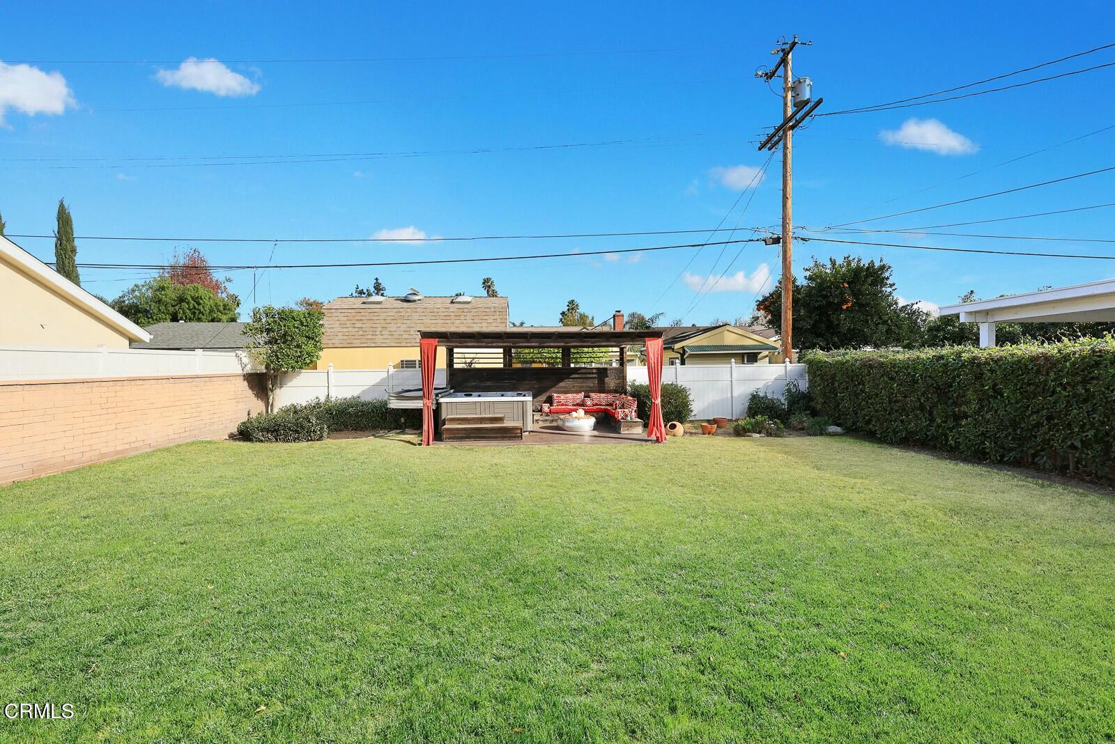 6708 Ranchito Avenue Van Nuys, CA 91405 - Photo 31 of 37 a backyard of a house with table and chairs