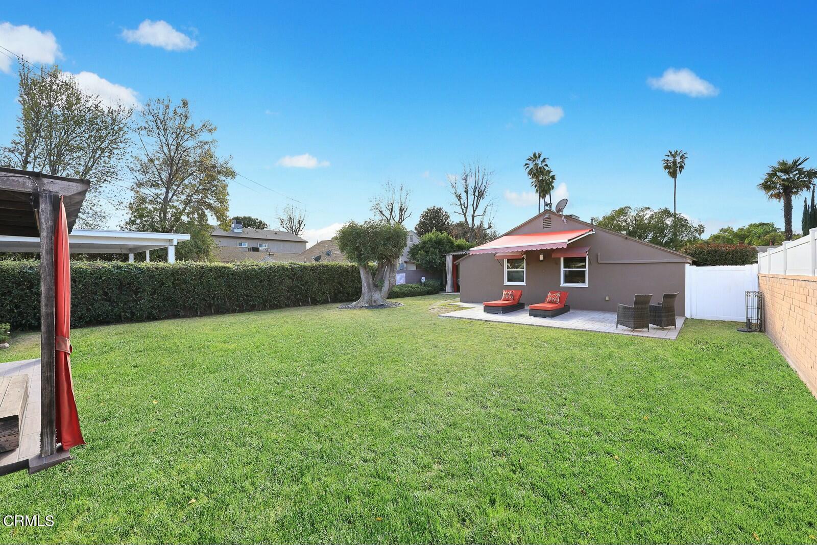 6708 Ranchito Avenue Van Nuys, CA 91405 - Photo 34 of 37 a view of an house with backyard space and porch