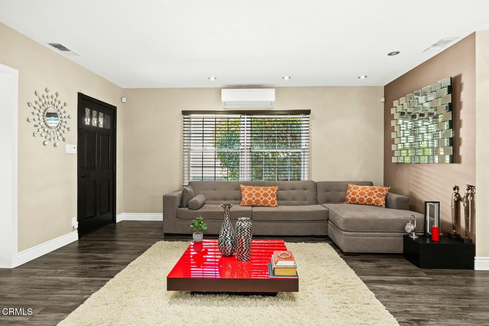 6708 Ranchito Avenue Van Nuys, CA 91405 - Photo 8 of 37 a living room with furniture and a large window