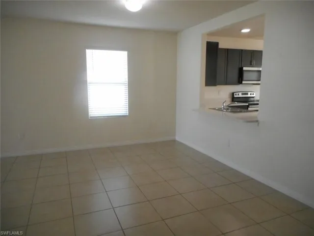 a kitchen with a sink cabinets and appliances