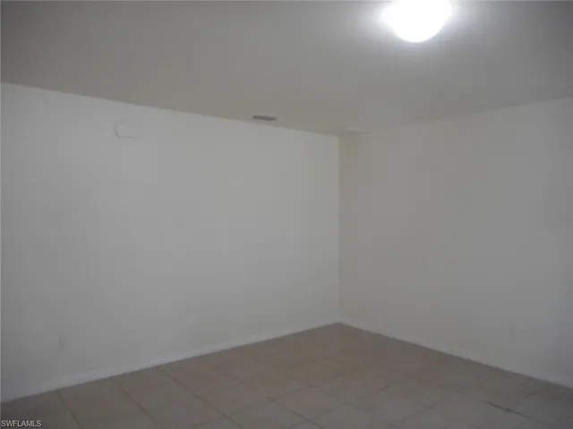 a view of an empty room and closet