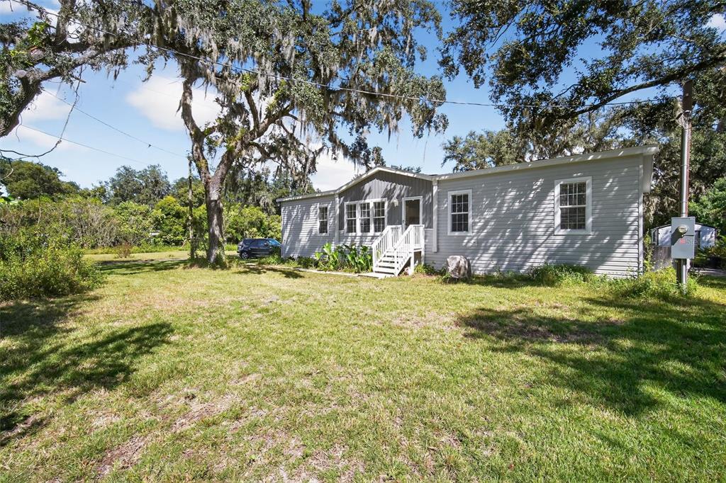 12706 McIntosh Road Plant City, FL 33565 - Photo 2 of 30 front view of house with a yard