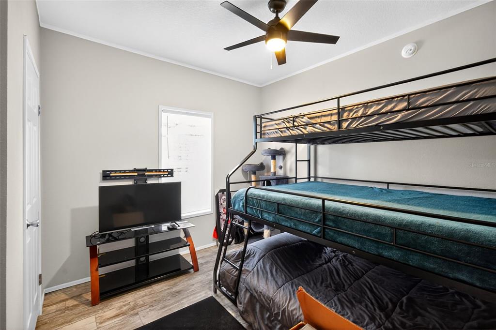 12706 McIntosh Road Plant City, FL 33565 - Photo 24 of 30 a bedroom with furniture and a ceiling fan