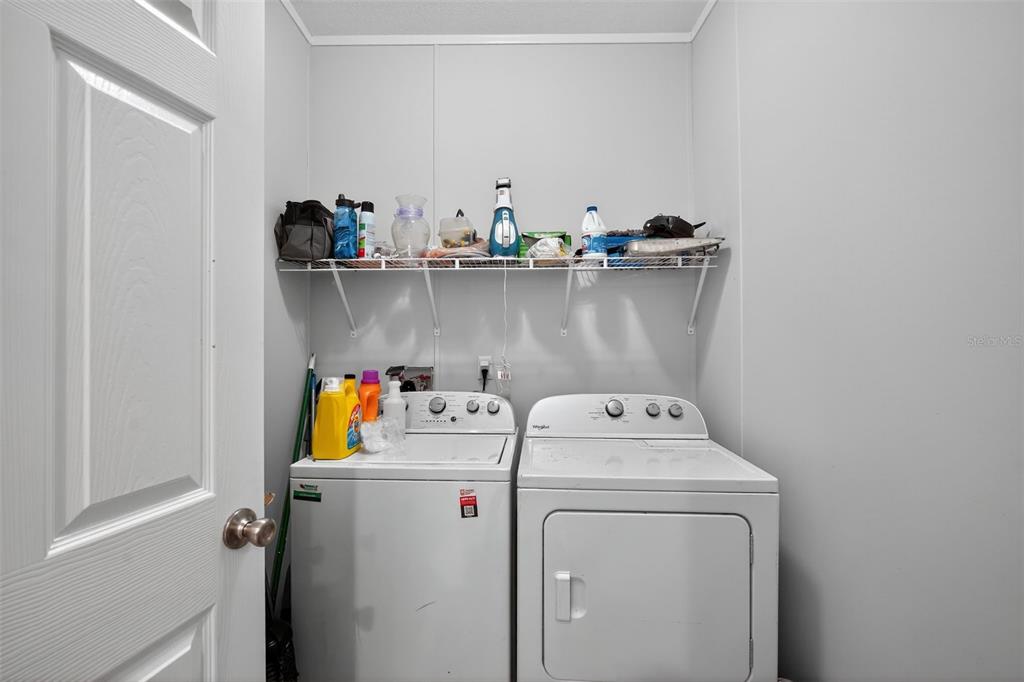 12706 McIntosh Road Plant City, FL 33565 - Photo 26 of 30 a utility room with dryer and washer