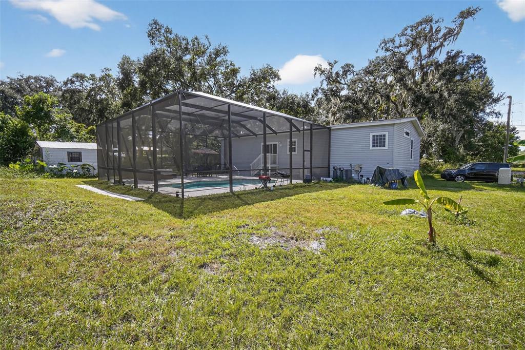 12706 McIntosh Road Plant City, FL 33565 - Photo 27 of 30 a view of a house with a yard