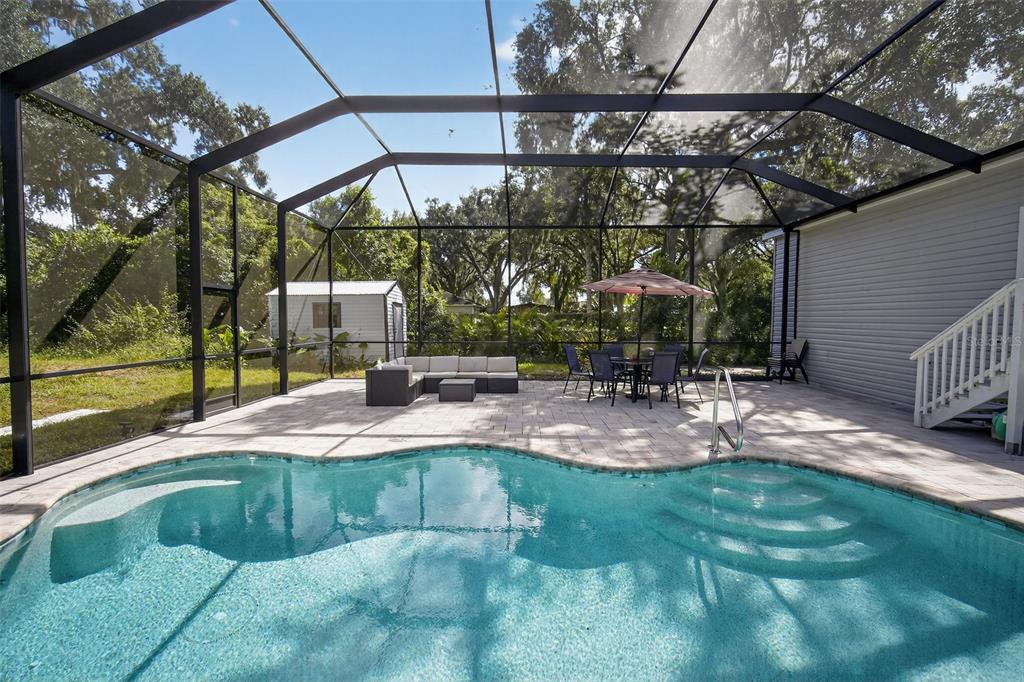 12706 McIntosh Road Plant City, FL 33565 - Photo 7 of 30 a view of a backyard with a patio