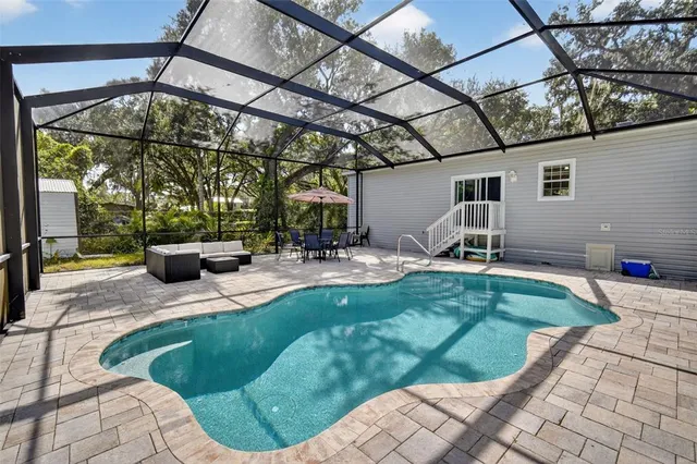 a view of a backyard with a patio and plants