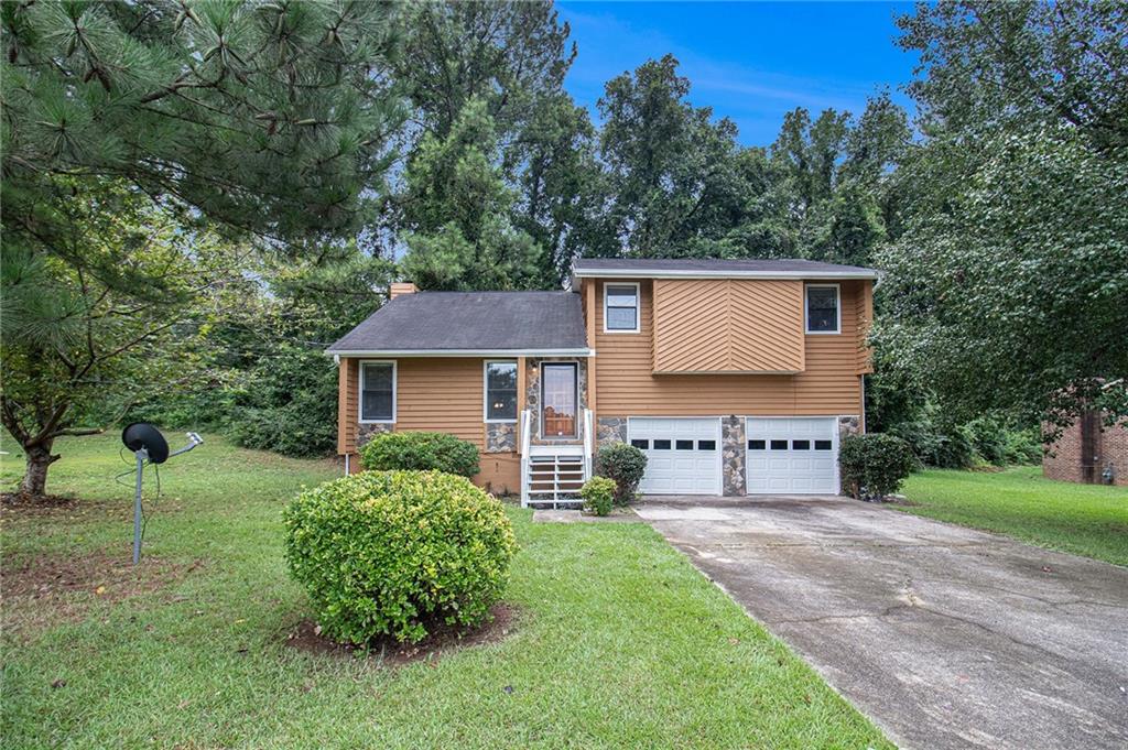 front view of a house with a yard