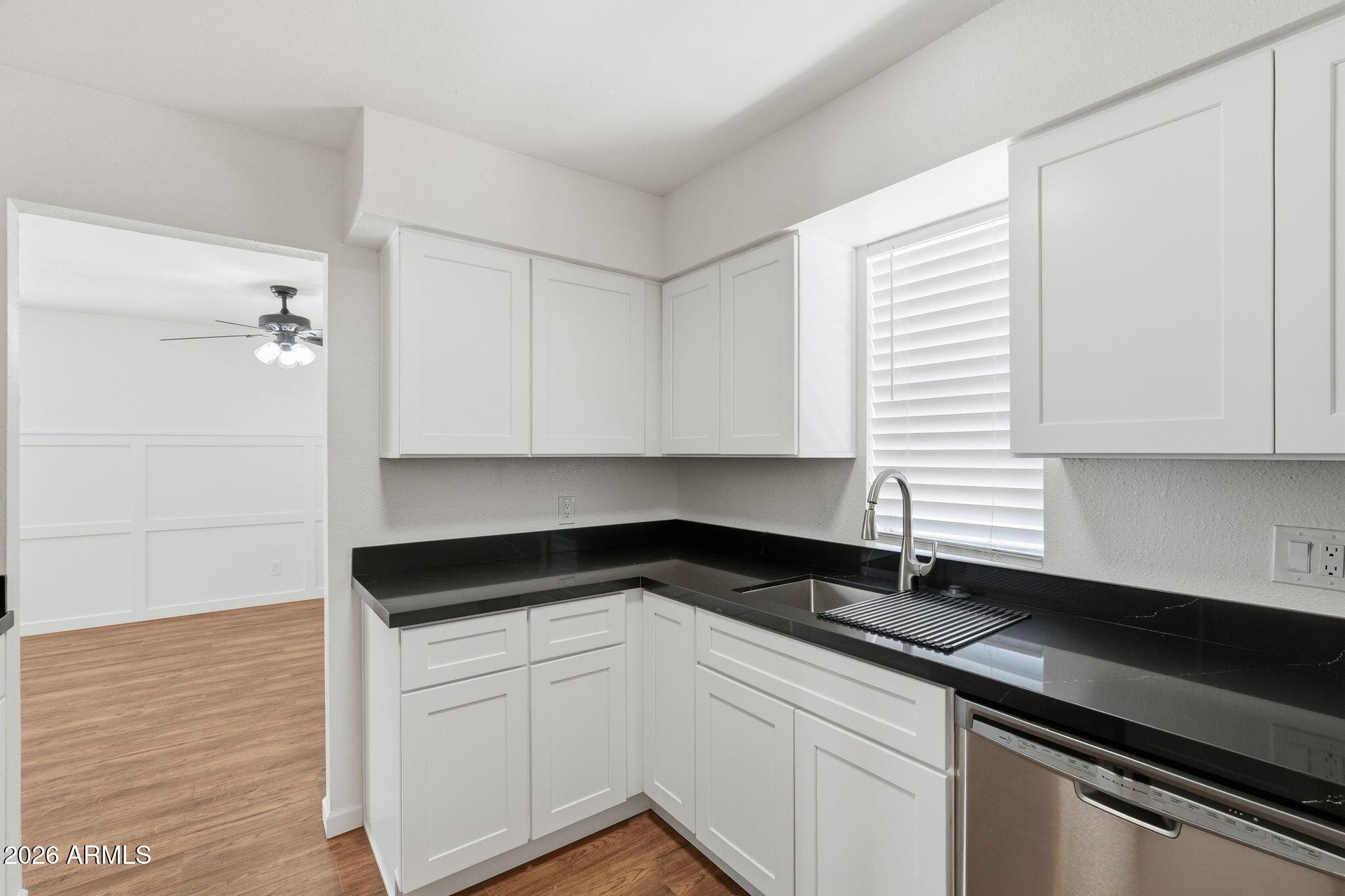 231 North Robson, Unit 7 Mesa, AZ 85201 - Photo 13 of 29 a kitchen with a sink and cabinets