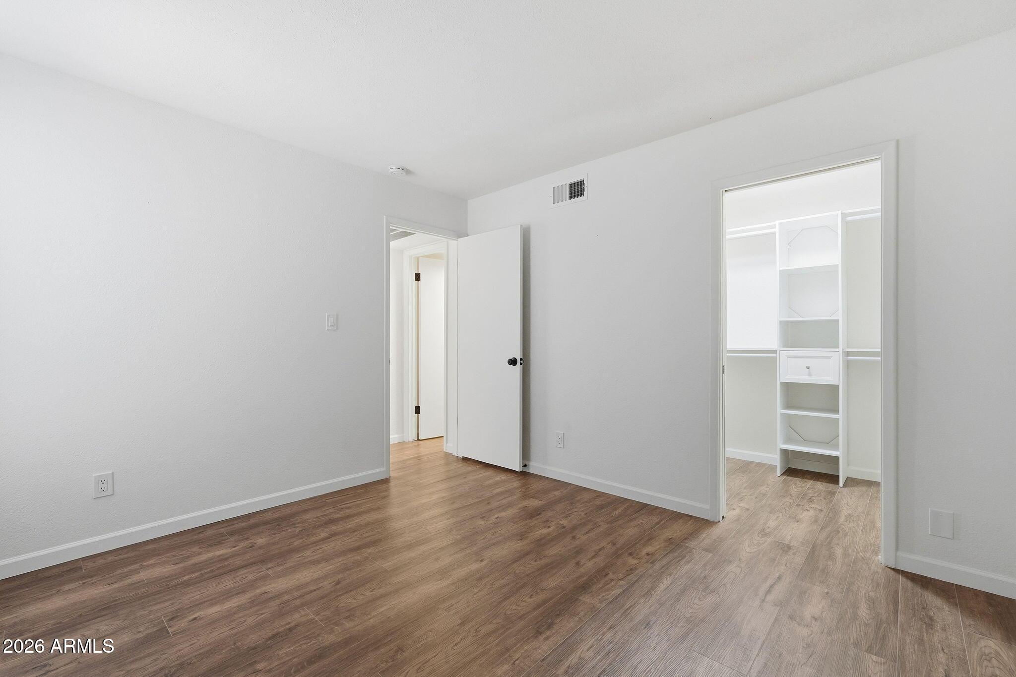 231 North Robson, Unit 7 Mesa, AZ 85201 - Photo 17 of 29 a view of an empty room with wooden floor