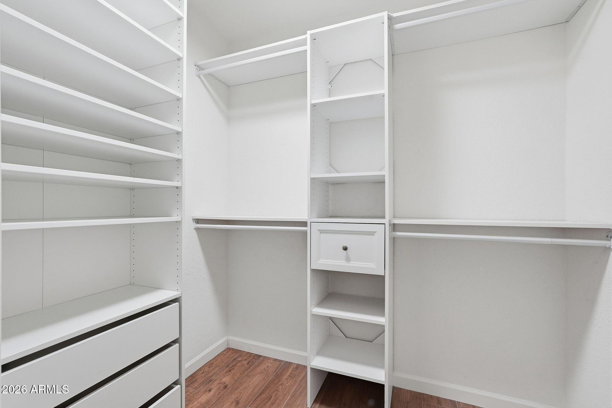 231 North Robson, Unit 7 Mesa, AZ 85201 - Photo 18 of 29 a view of walk in closet with empty racks