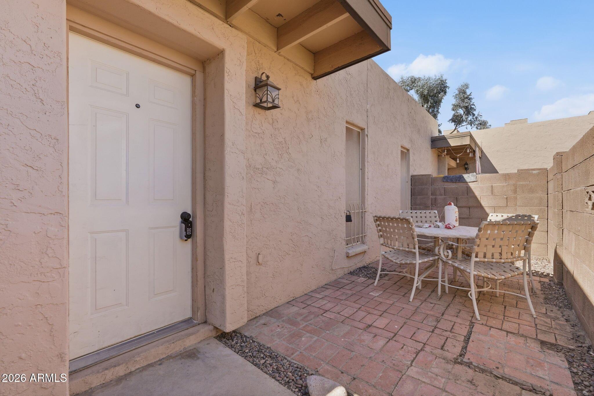 231 North Robson, Unit 7 Mesa, AZ 85201 - Photo 24 of 29 a view of a dining room with a table and chairs