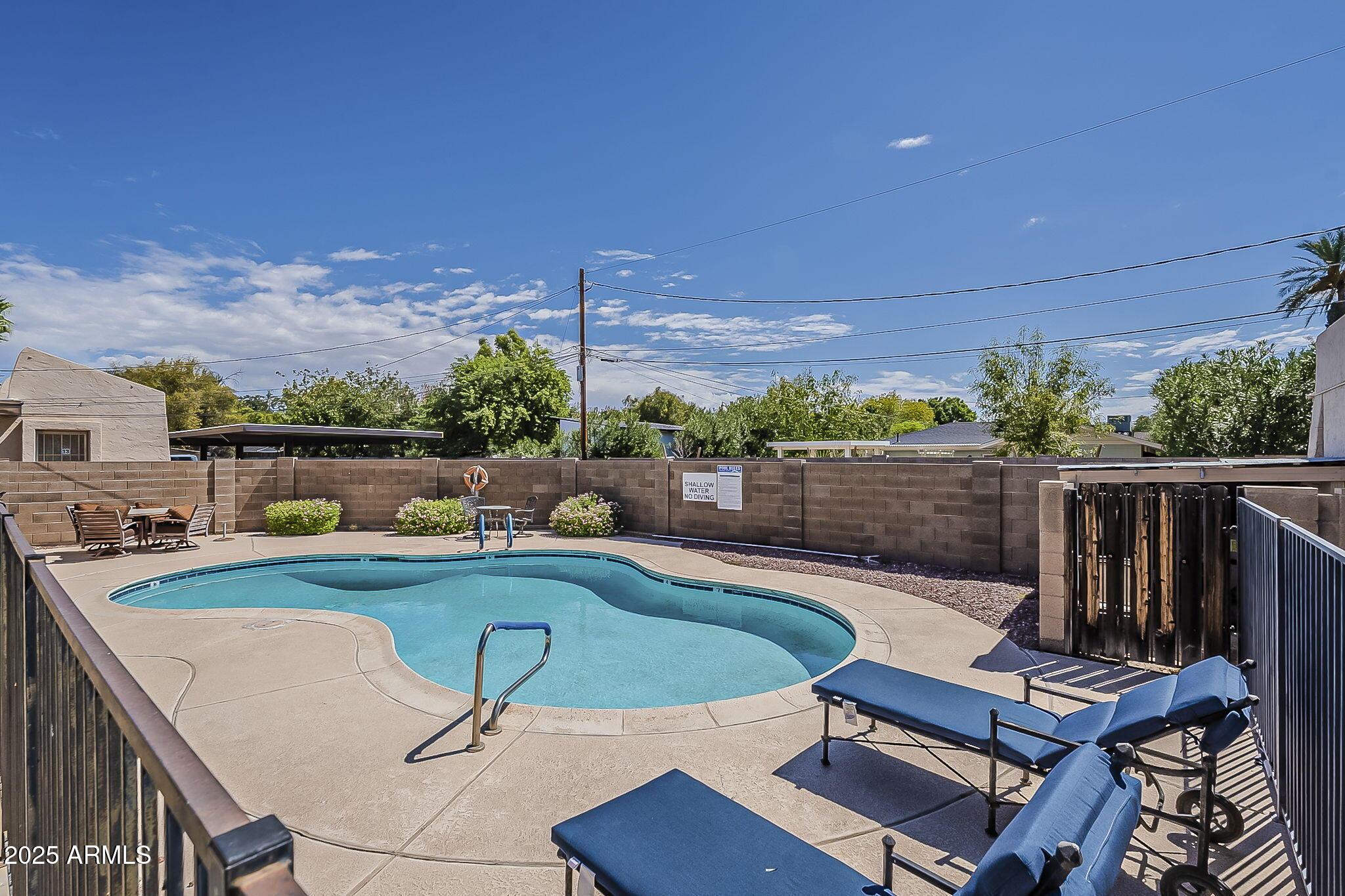 231 North Robson, Unit 7 Mesa, AZ 85201 - Photo 3 of 29 a view of a chairs and table in the terrace