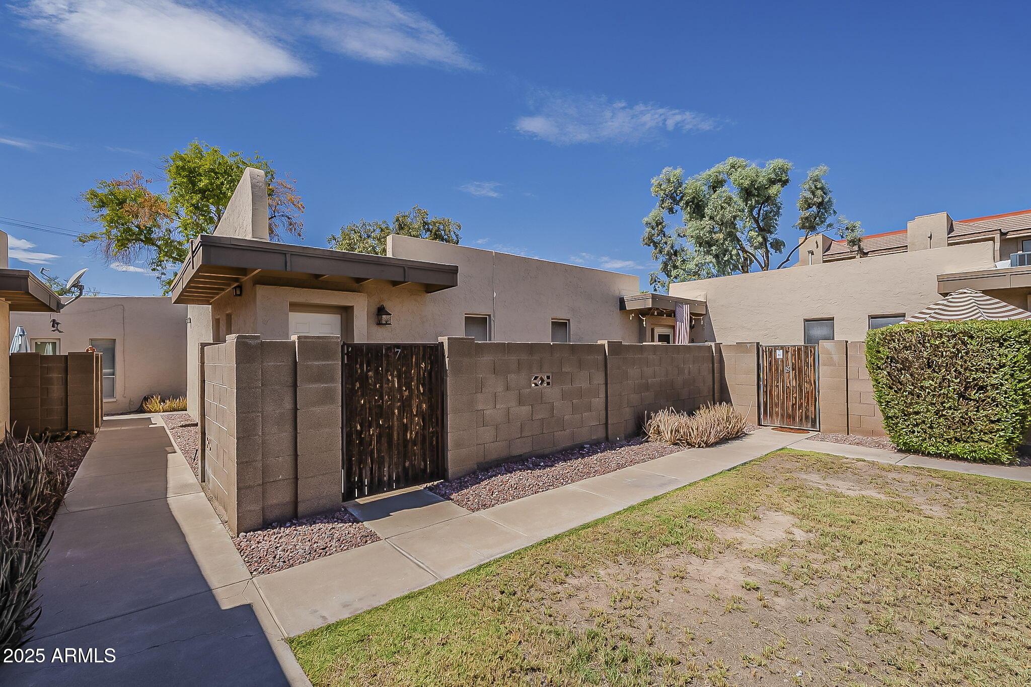 231 North Robson, Unit 7 Mesa, AZ 85201 - Photo 4 of 29 a view of a house with a patio