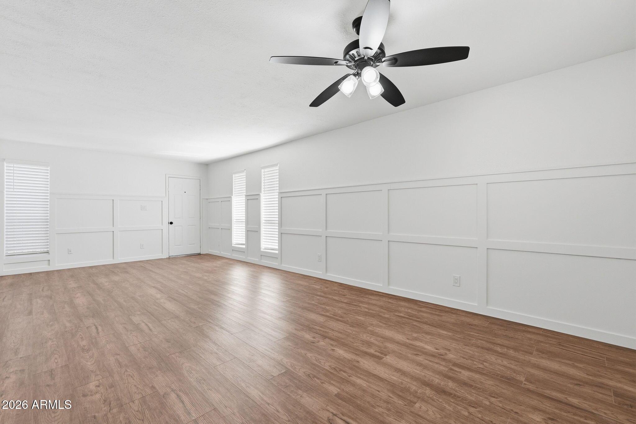 231 North Robson, Unit 7 Mesa, AZ 85201 - Photo 8 of 29 a view of an empty room with wooden floor