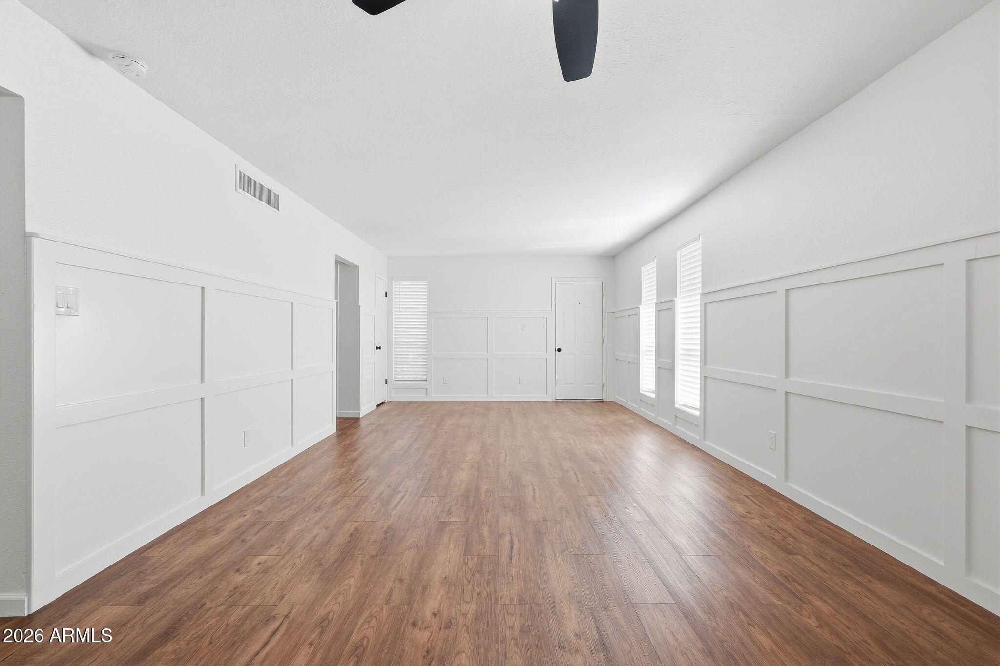 231 North Robson, Unit 7 Mesa, AZ 85201 - Photo 9 of 29 a view of an empty room with wooden floor