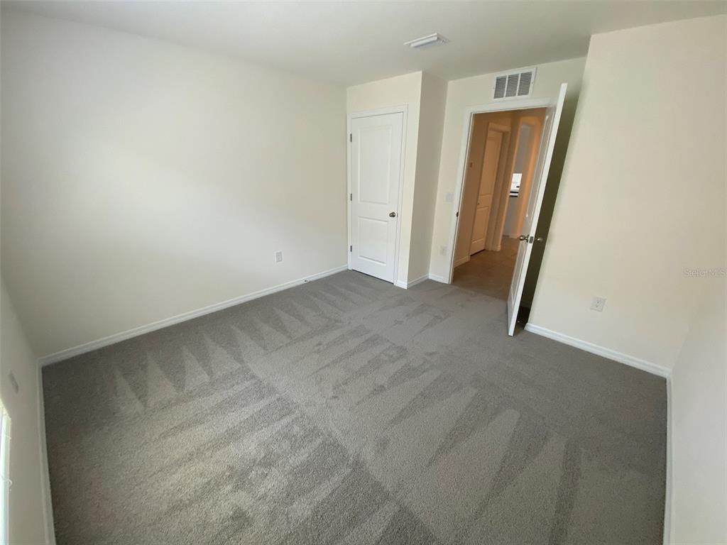 4961 Southwest 88th Place Ocala, FL 34476 - Photo 14 of 50 an empty room with windows