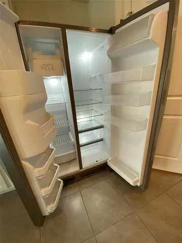 a kitchen with a sink stove and refrigerator