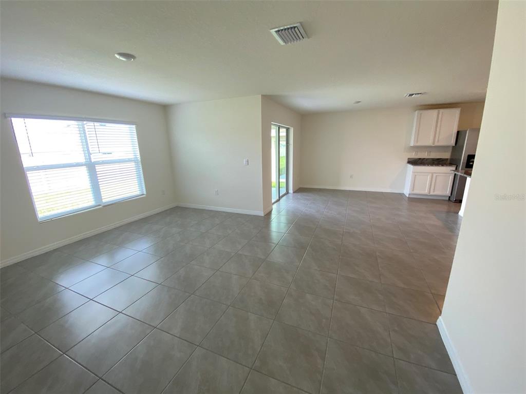 4961 Southwest 88th Place Ocala, FL 34476 - Photo 25 of 50 a view of an empty room with a window