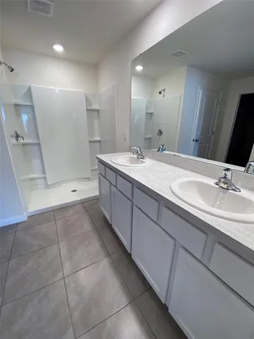 a view of an empty room with windows