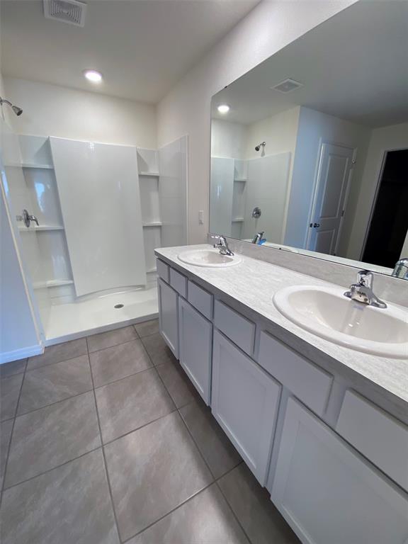 4961 Southwest 88th Place Ocala, FL 34476 - Photo 34 of 50 a bathroom with a sink a toilet and mirror