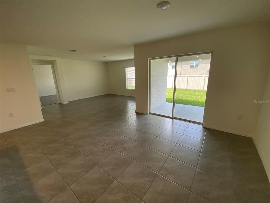 4961 Southwest 88th Place Ocala, FL 34476 - Photo 35 of 50 a view of a livingroom with an empty space and a window