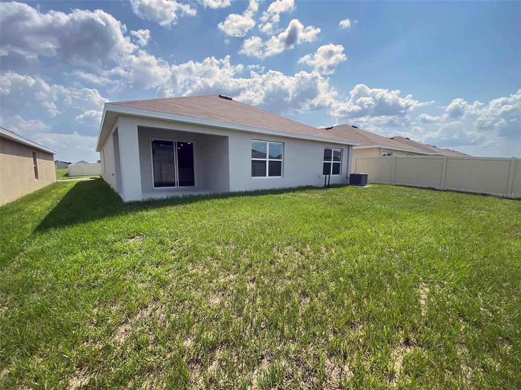 4961 Southwest 88th Place Ocala, FL 34476 - Photo 38 of 50 a house view with a garden space