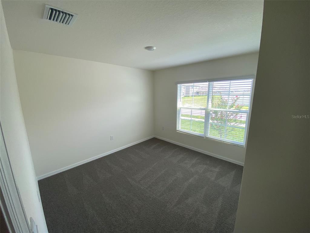 4961 Southwest 88th Place Ocala, FL 34476 - Photo 4 of 50 a view of an empty room with a window